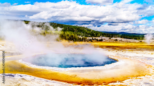 Steam coming out of the Crested Pool in the Upper Geyser Basin along the Continental Divide Trail in Yellowstone National Park, Wyoming, United States