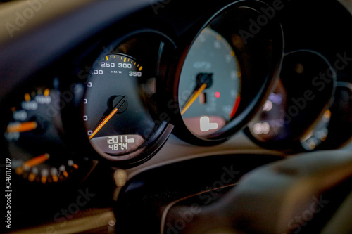 speedometer close up of a black Porsche GT3