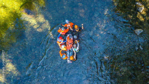 Search and Rescue Training Carrying Patient through a River 