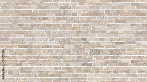 Brick wall seamless texture. Beige stone pattern background