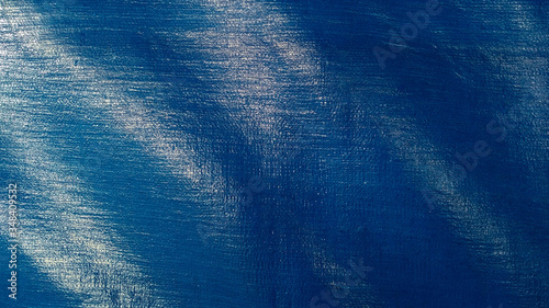 Shiny blue tarpaulin plastic texture