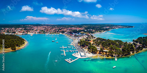 Beautiful wide panoramic aerial view from Medulin town and Medulin marina and boats under beautiful blue sky with nice white clouds aerial view, Croatia