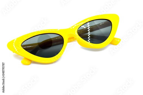 Yellow sunglasses fashion isolated on yellow background