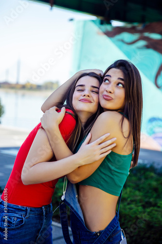 Two best female friends embracing together