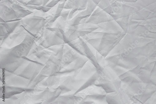 Crumpled white texture, crumpled white fabric, abstract background