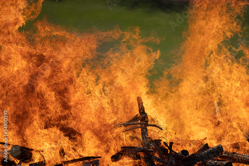 demolished wooden hut set on fire after demolition