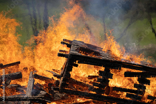 demolished wooden hut set on fire after demolition