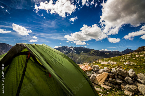 Camping tent in Gran Paradiso, with a beautiful summer mountain view of the Alps