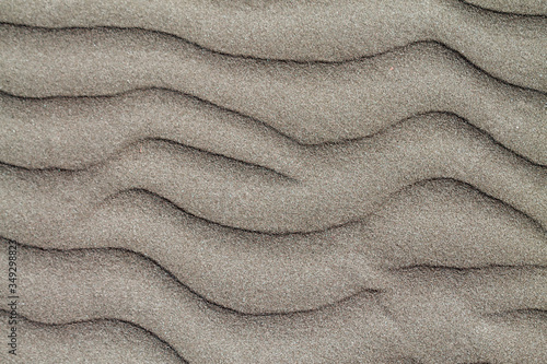 Texture of dry sand surface with horizontal ripples