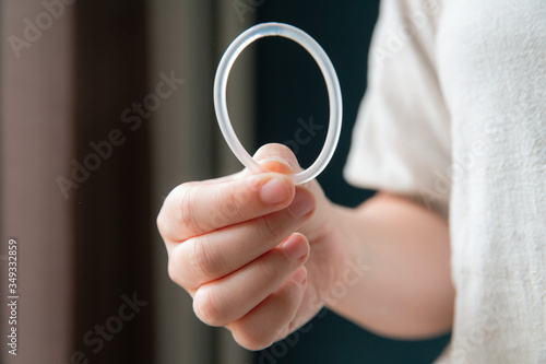 Woman's hand holding a birth control ring, vaginal ring for contraceptive