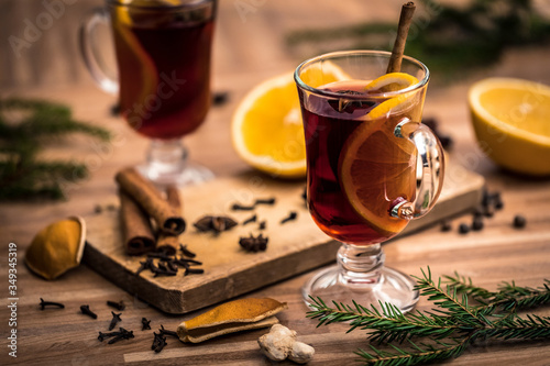 mulled wine with spices on a wooden table