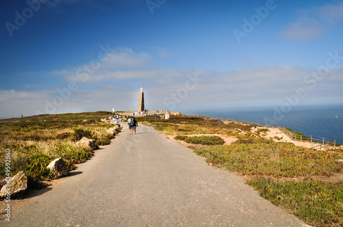  road to the monument's on the observation square over the ocean, people in the foreground. westernmost point of the europe