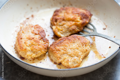 Kotlet schabowy - fried polish bread crumbs coated pork chops 