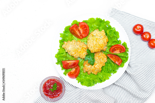 Chopped chicken meatballs on lettuce leaves. Baked chicken fillet cutlets. Dietary dish. Concept of shooting food for the menu. The dish of the restaurant. Beautiful serving of food.