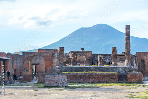 Pompeii in Italy, ruins of the antique Temple of Apollo with bronze Apollo statue, Naples.