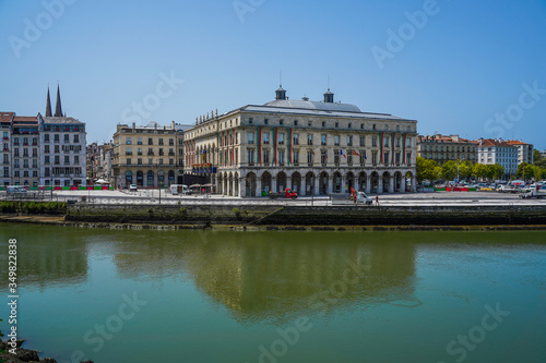 The city of Bayonne in France with buildings in the Nive River