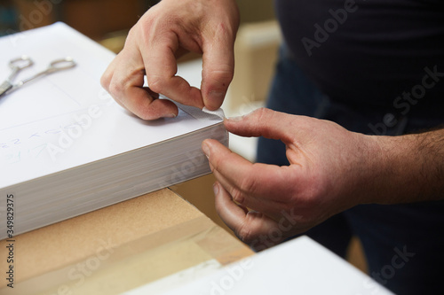 book binder working in a warehouse