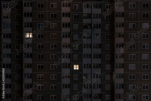 Flat night panorama of light in windows of multistory buildings. life in big city. concept for a couple in love on isolation