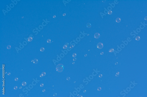 Natural soap bubbles in blue skies