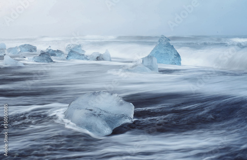 pieces of ice in ocean waves