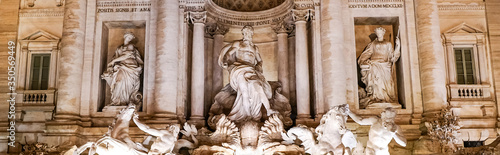 panoramic concept of trevi fountain with ancient sculptures in rome
