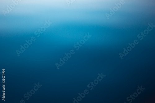 Blue water surface. Deep blue water background. Beautiful background, space for text.