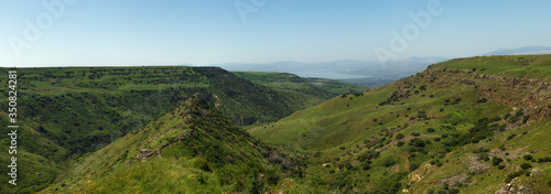 Israeli national park Gamla fortress at the Golan Heights with the Sea of Galilee in the distance