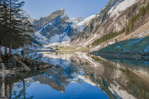 Breathtaking landscape of mountain lake with reflection of beautiful summit. Concept of Wanderlust, mountain hiking and travel. Beautiful landscape.