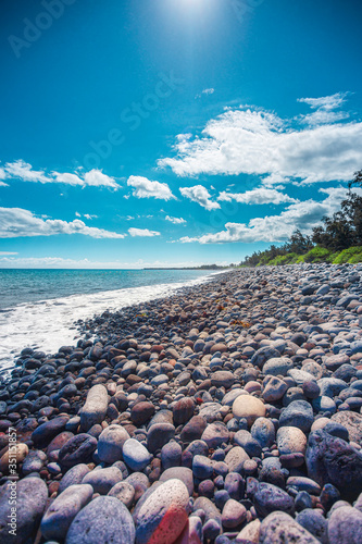 Basalt rock beach in the bay of Saint-Paul eroded by the sea - Reunion island