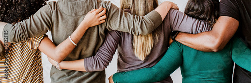 Rearview of diverse people hugging each other