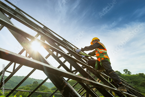 Safety body construction, Working at height equipment. Fall arrestor device for worker with hooks for safety body harness on the roof structure