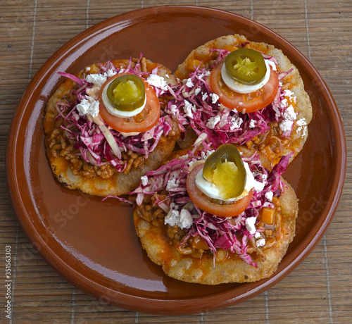 Honduran enchiladas with meat, vegetables and egg