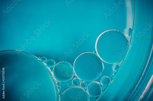 Oil drops on the water - Abstract background blue macro photography