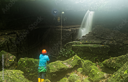 ecuador mayei cave entrance with speleologist