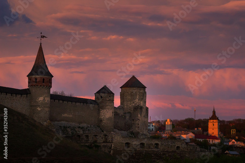 Sunset view on the castle in Kamianets-Podilskyi in spring.