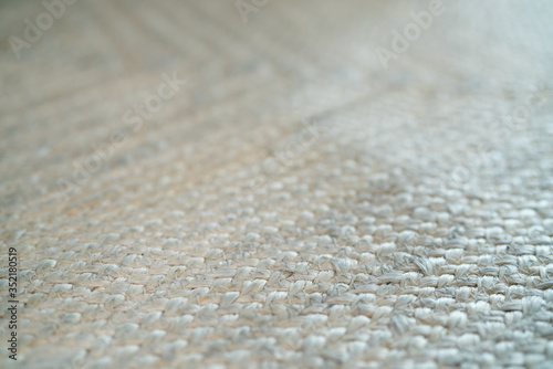 pale jute floor rag background closeup