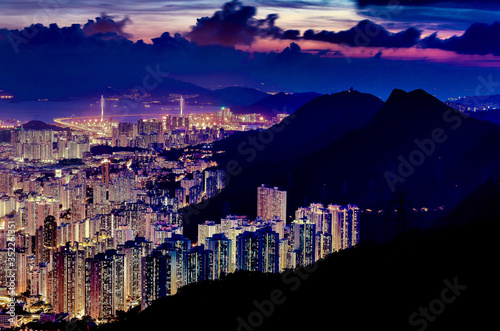 Aerial night view of Kowloon urban area and Mong Kok District, the highest population density areas in the world with 130,000 people in one square kilometre, in Hong Kong, China.