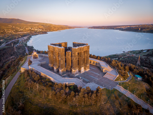 Aerial view down to monument of Chronicles of Georgia in Sakartvelo with Tbilisi sea lake in the background. Sightseeing and tourist sites in Caucasus.Tbilisi Georgia. 2020