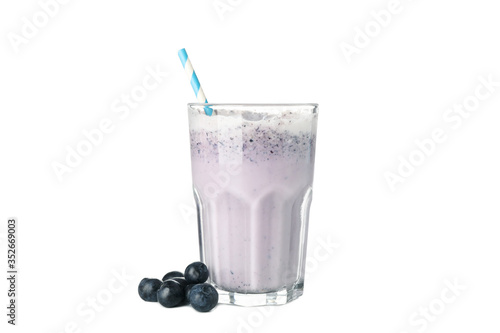 Glass of blueberry milkshake isolated on white background