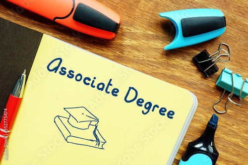 Conceptual photo about Associate Degree with handwritten phrase.