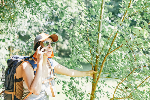 Woman in the nature making a phone call