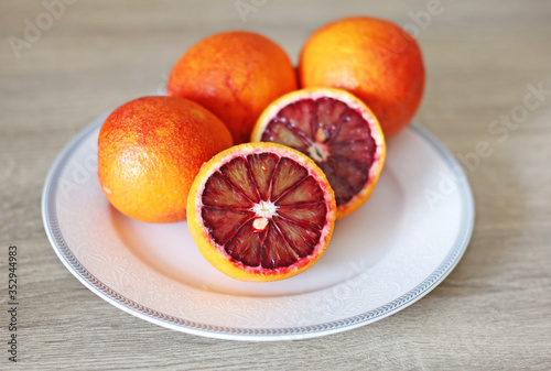 oranges in the plate - tarocco blood orange - sanguine orange - red orange