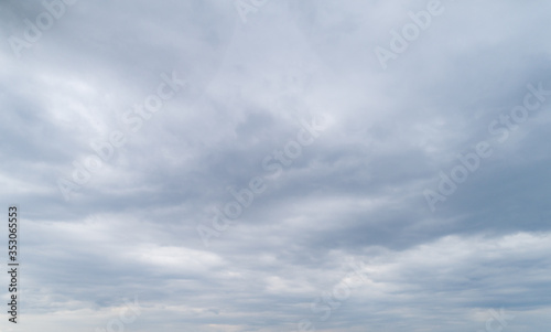 Cloudy gray sky with thick dense clouds.