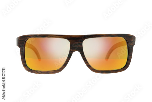 Wooden dark brown sunglasses with orange glasses on white background