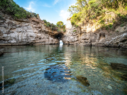 Ruins of roman Villa di Pollio Felice called Bagni della regina Giovanna (baths of Queen Giovanna) with natural rock bridge at Sorrento coast, Naples, Campania, Italy