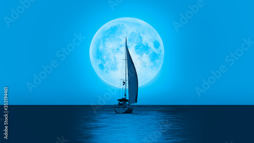Lone yacht with super blue full moon "Elements of this image furnished by NASA "