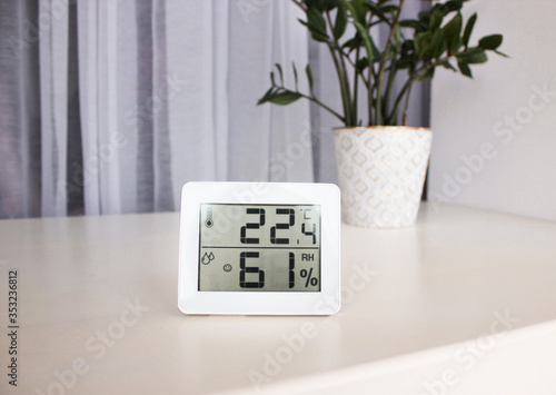 Thermometer hygrometer measuring the optimum temperature and humidity in a house, apartment or office, a photo for articles about the house’s microclimate, health, disease relief and virus treatment