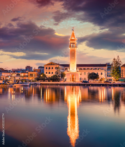 Colorful evening cityscape of Zakynthos town with Saint Dionysios Church, Zakynthos island, Greece, Europe. Unbelievable summer sunset on Mediterranean sea. Ionian Sea, Traveling concept background.