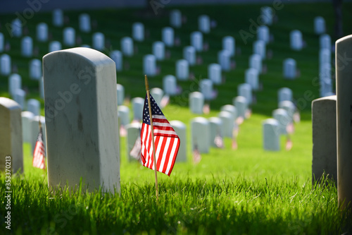 Arlington National Cemetery - Headstones and U.S. National flags - Circa Washington D.C. United States of America