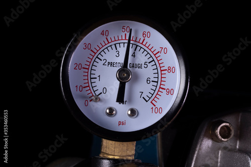 Air compressor manometer close-up. Pressure gauge measurement.